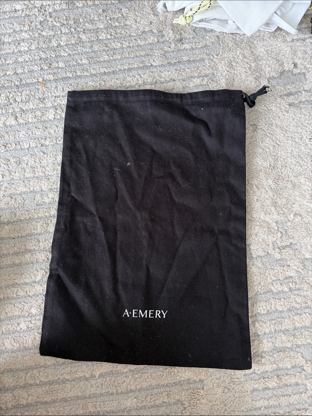 A. Emery Black Drawstring Dust Bag